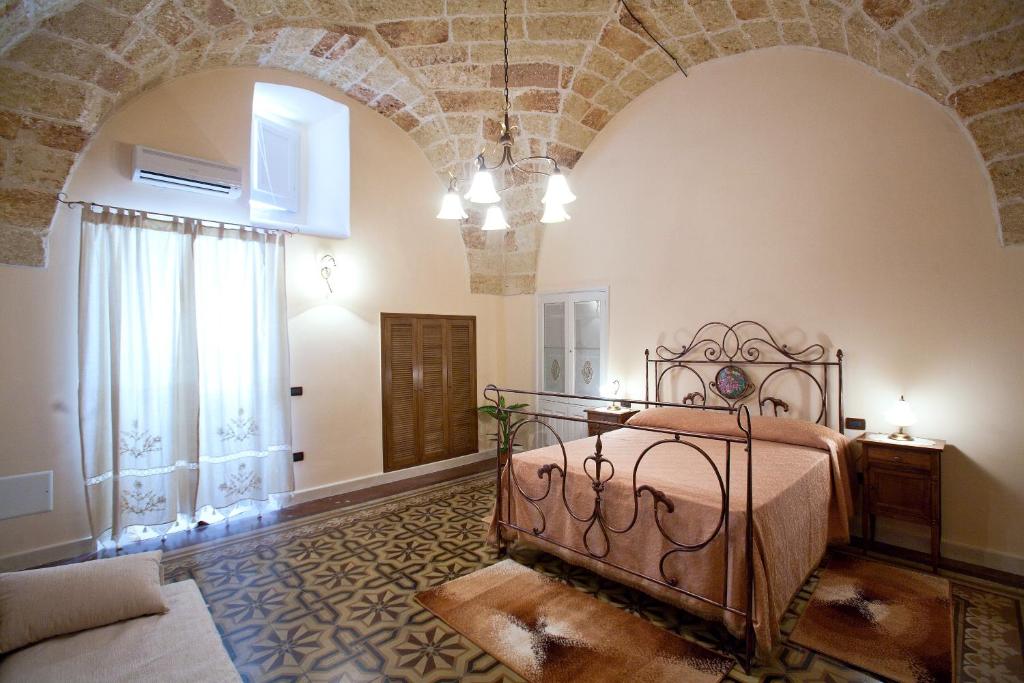 Postel nebo postele na pokoji v ubytování Residencefusaro appartamenti Specchia
