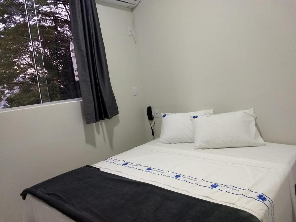 Postel nebo postele na pokoji v ubytování Hotel Flor Paulista