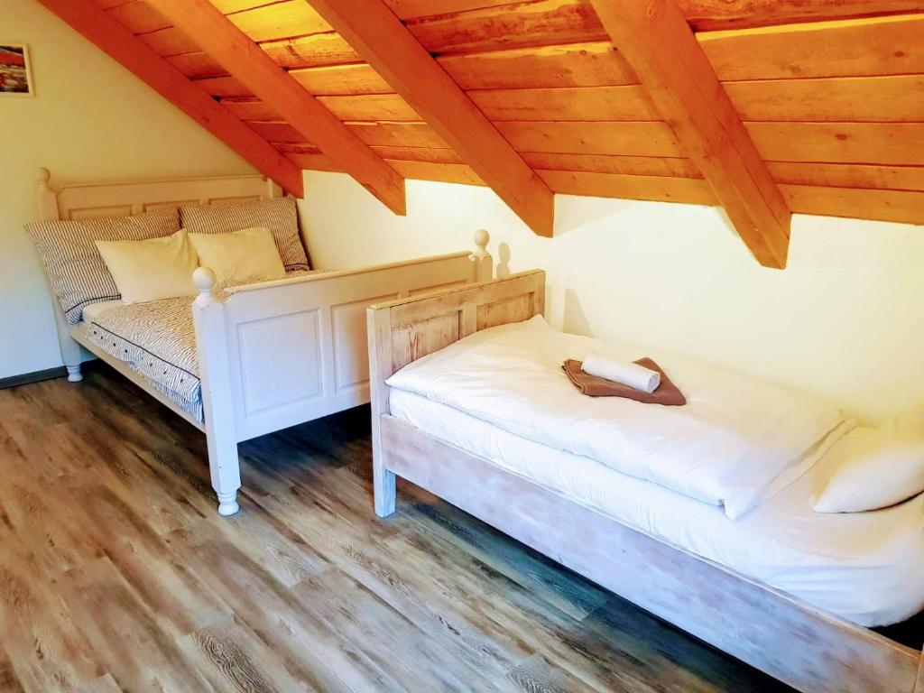 Postel nebo postele na pokoji v ubytování Čenovický dvůr