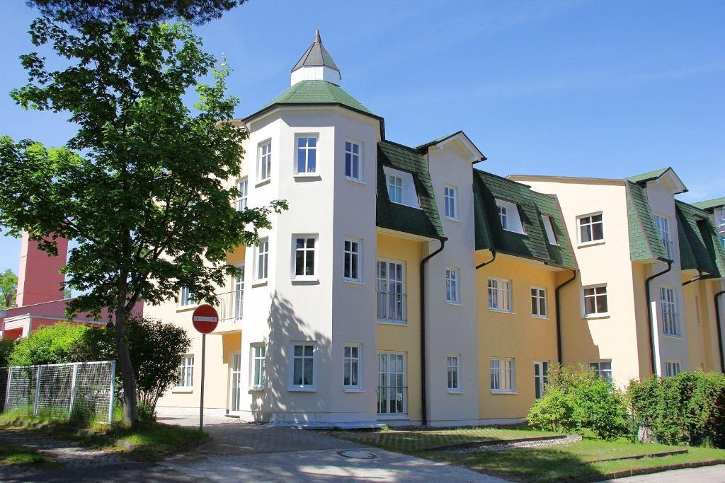 a building with a tower on top of it at Feriendomizil-Goethestr-App-06 in Ahlbeck