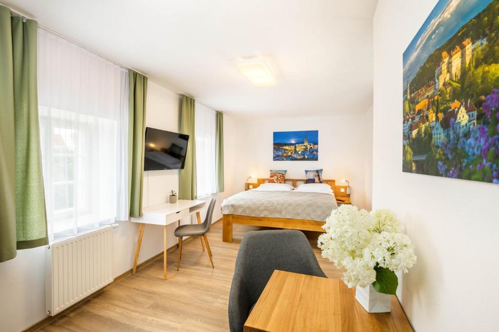 Postel nebo postele na pokoji v ubytování Hotel Garni Villa Areka