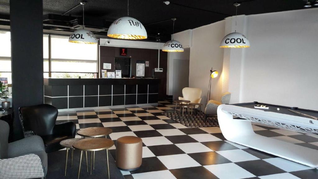 Posezení v ubytování Golden Tulip Roissy Saint Witz