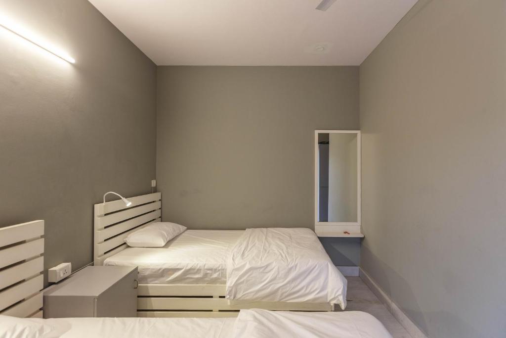 Postel nebo postele na pokoji v ubytování Woke HSR layout