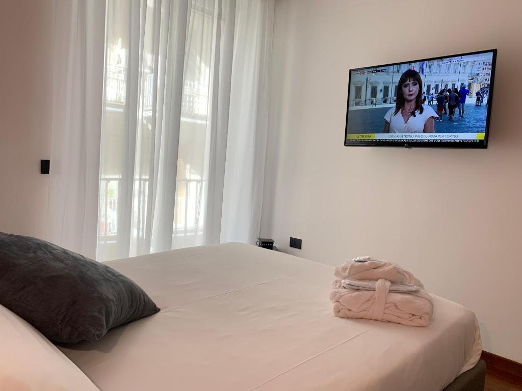 Łóżko lub łóżka w pokoju w obiekcie Cellamare Suite & Spa