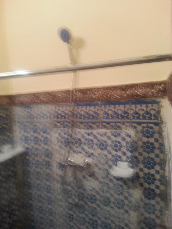 a bathroom with a shower with a toilet in it at RIAD DAR KADER chambre saumon in Marrakesh