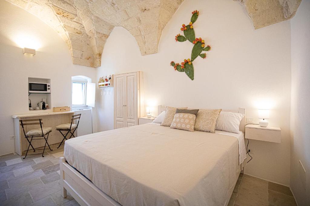 Postel nebo postele na pokoji v ubytování Radici Ostuni