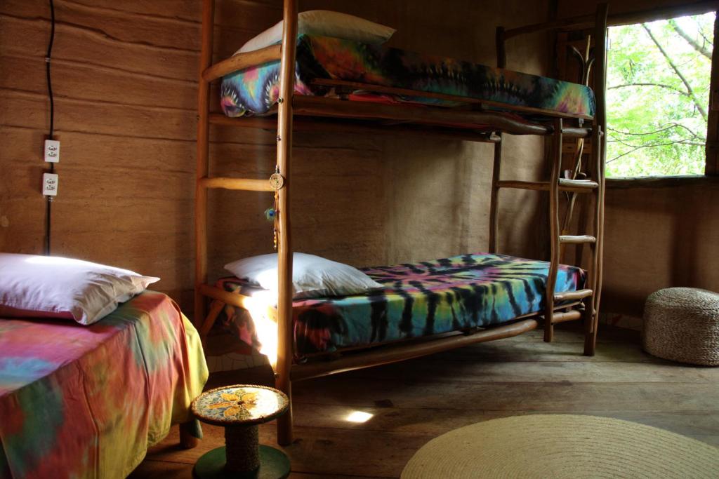 Raízes Eco Hostelにあるベッド