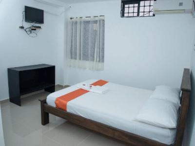 Postel nebo postele na pokoji v ubytování Aparta Hotel El Cacique Upar