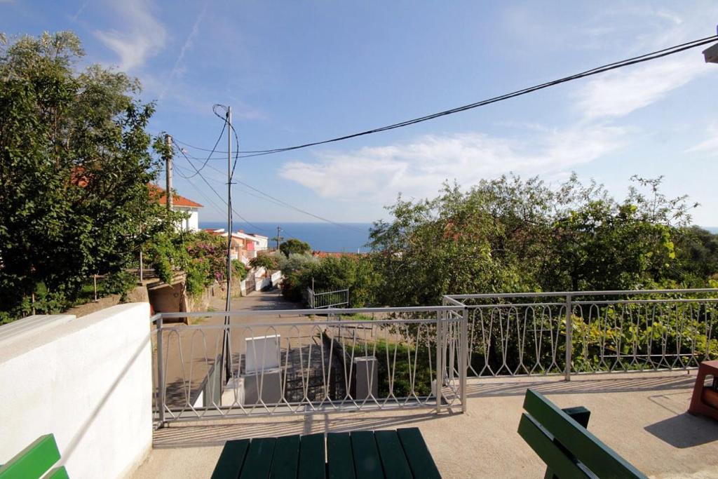 a balcony of a house with a gate and a street at Apartments Mirko in Ulcinj