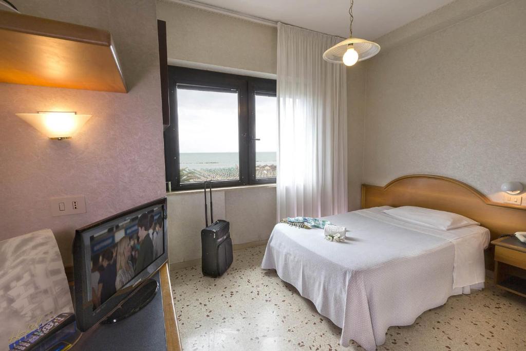 Postel nebo postele na pokoji v ubytování Hotel Maja