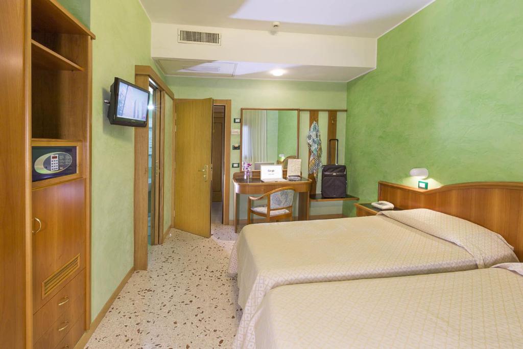 Postel nebo postele na pokoji v ubytování Hotel Maja