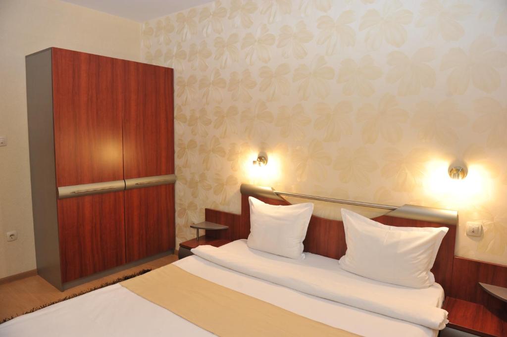 Postel nebo postele na pokoji v ubytování Eros Motel