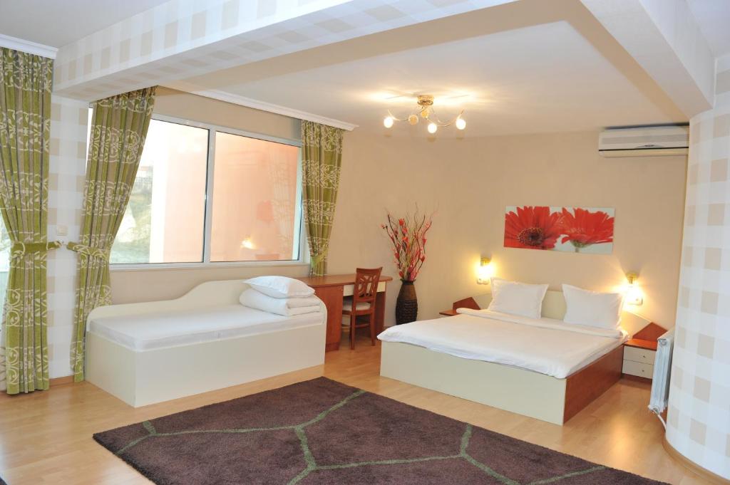 Postel nebo postele na pokoji v ubytování Eros Motel
