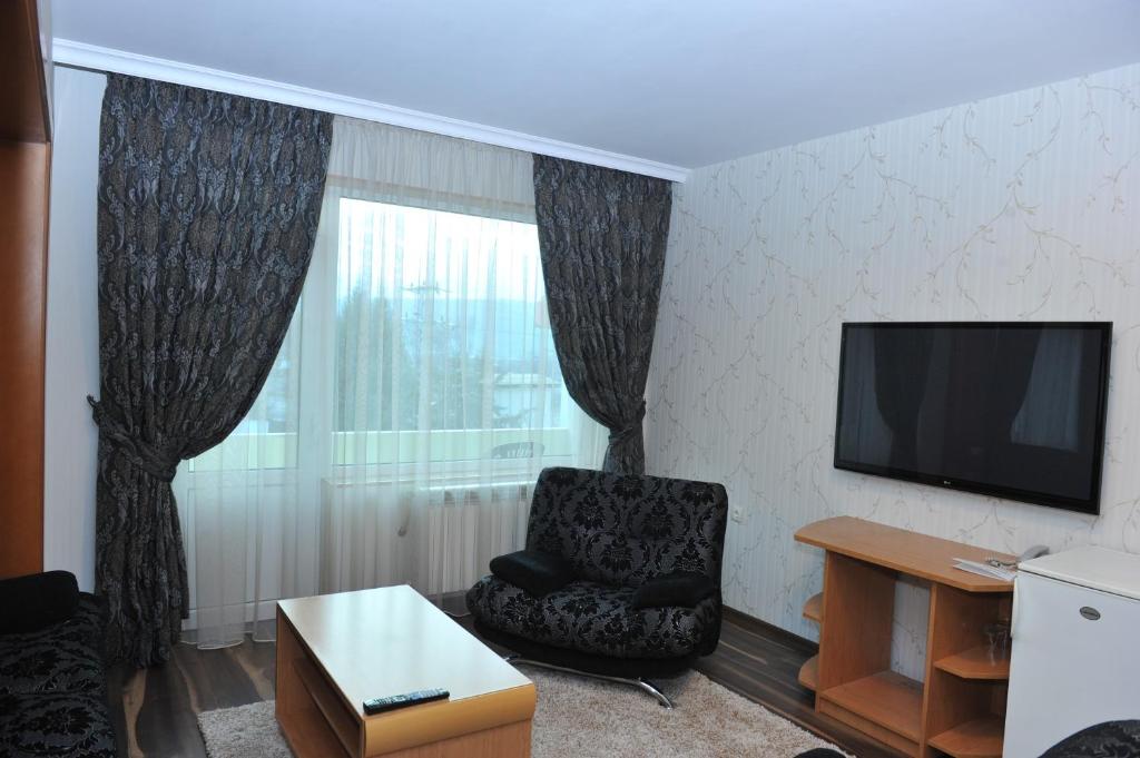 TV a/nebo společenská místnost v ubytování Eros Motel