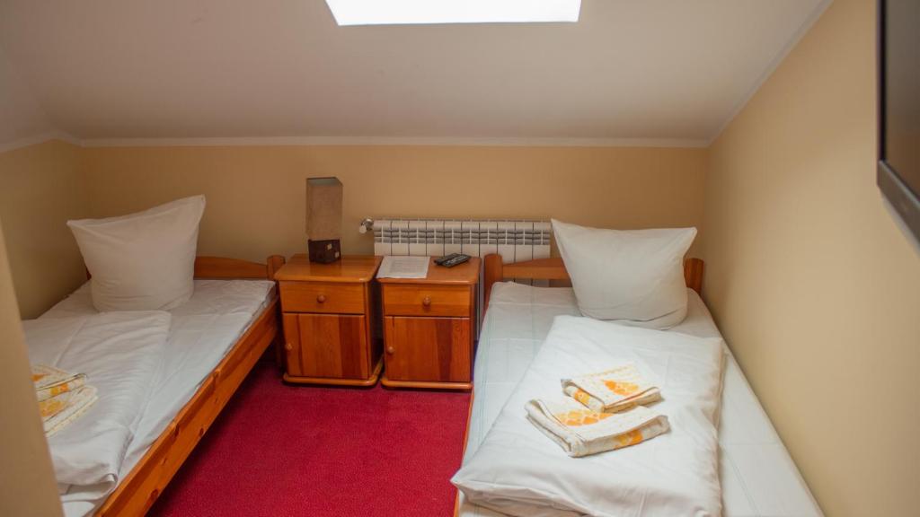 Posteľ alebo postele v izbe v ubytovaní Motelik Lord