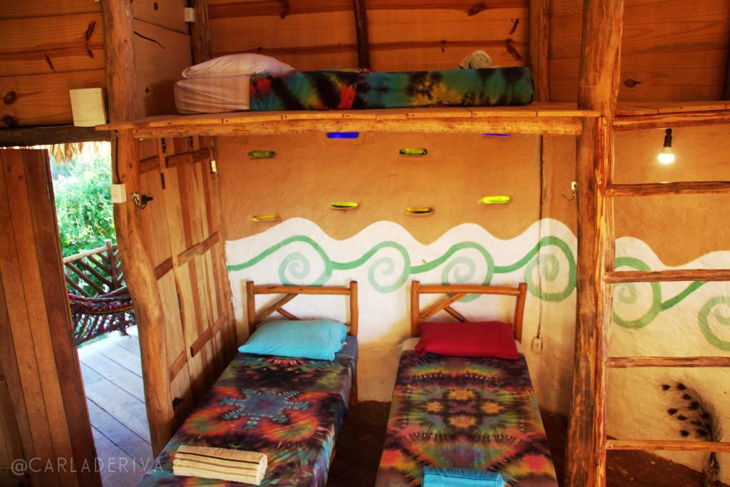 Raízes Eco Hostelにあるベッド