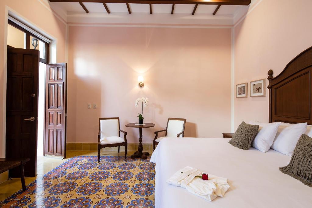 A bed or beds in a room at Casa Tavera- Adults Only