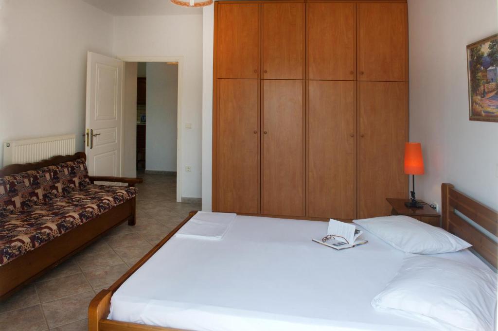 Posteľ alebo postele v izbe v ubytovaní Riverside Αpartments