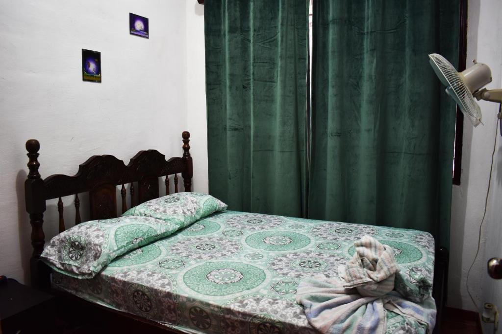 Postel nebo postele na pokoji v ubytování Casa Quepos
