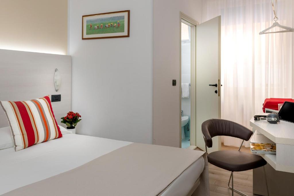 Postel nebo postele na pokoji v ubytování Hotel Maria Serena