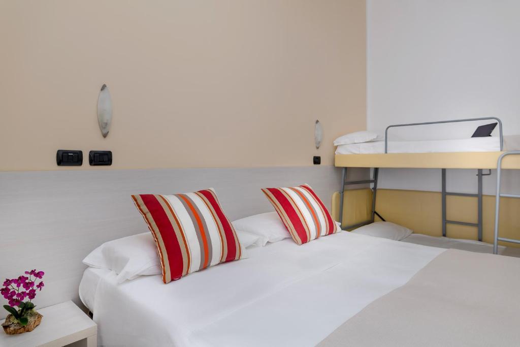 Postel nebo postele na pokoji v ubytování Hotel Maria Serena