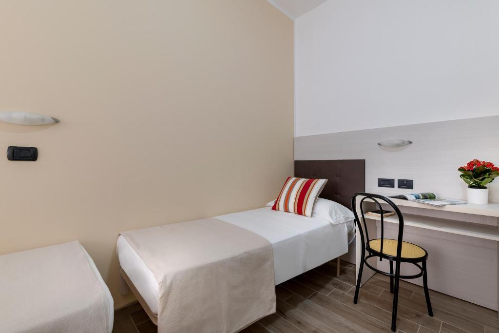 Postel nebo postele na pokoji v ubytování Hotel Maria Serena