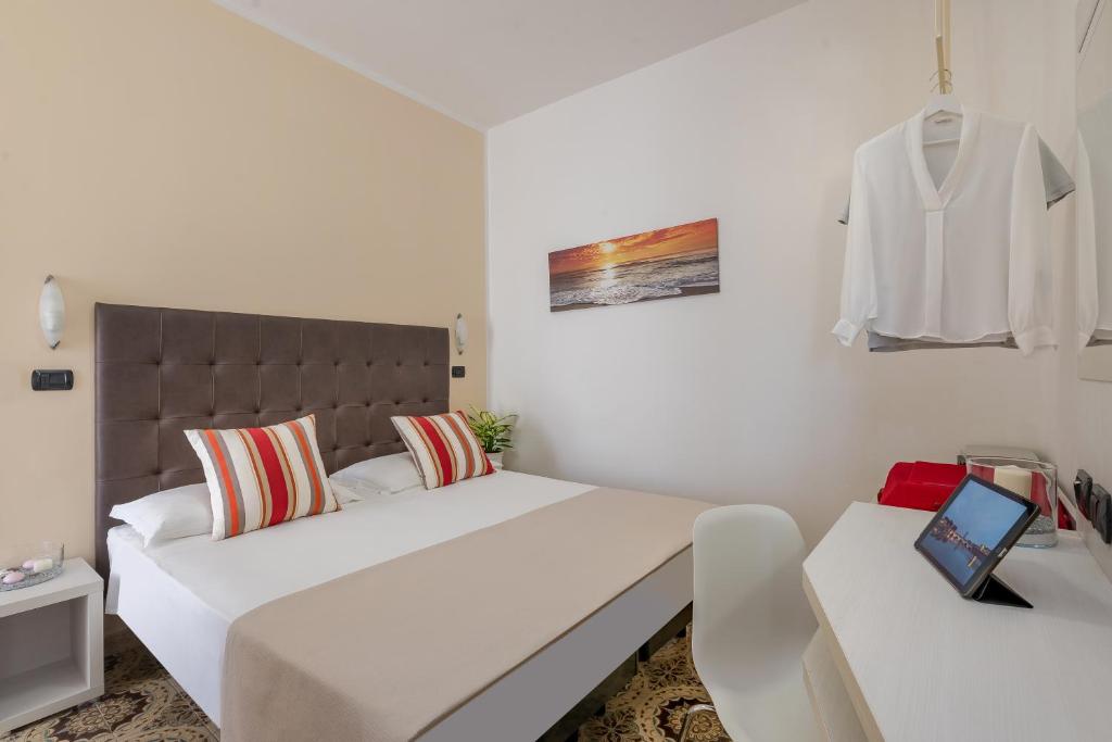 Postel nebo postele na pokoji v ubytování Hotel Maria Serena