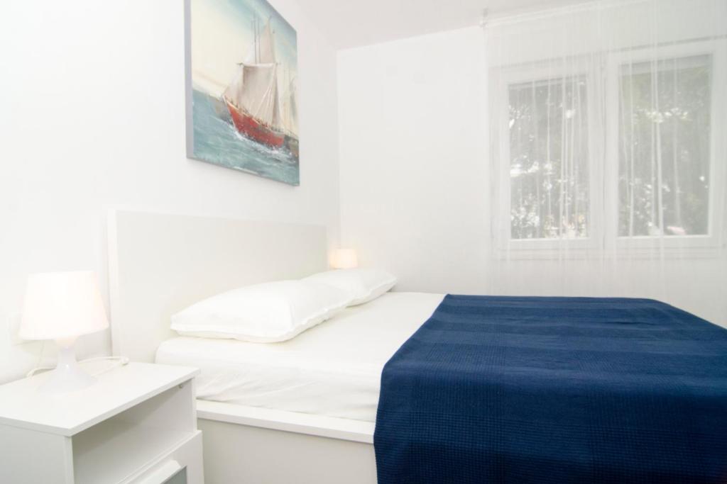 Posteľ alebo postele v izbe v ubytovaní Apartman M&D