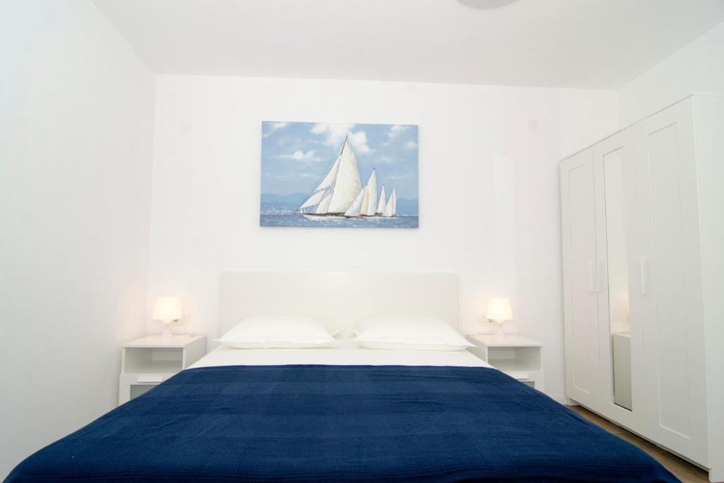 Posteľ alebo postele v izbe v ubytovaní Apartman M&D