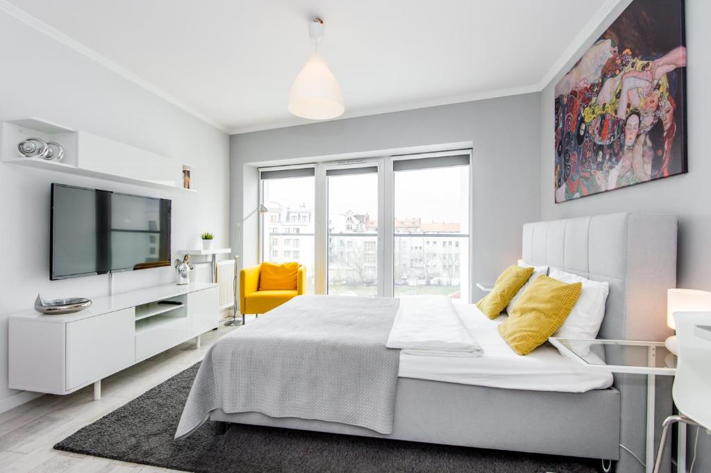 Posteľ alebo postele v izbe v ubytovaní Super-Apartamenty Old Market