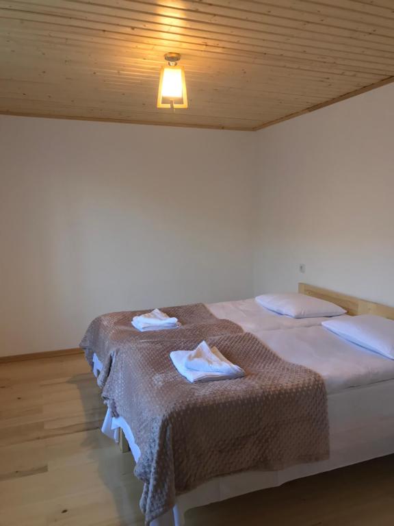 Postel nebo postele na pokoji v ubytování GUEST HOUSE ,, MEMORY''