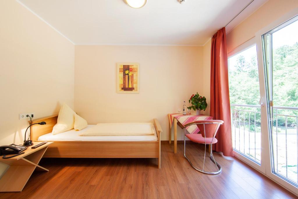 Postel nebo postele na pokoji v ubytování Heidsmühle