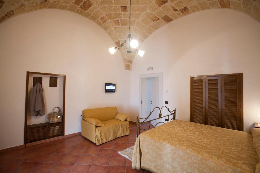 Postel nebo postele na pokoji v ubytování Residencefusaro appartamenti Specchia