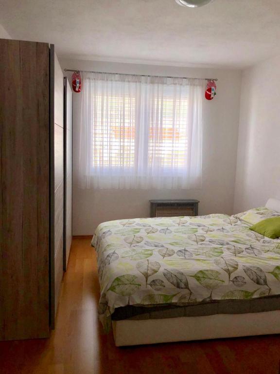 Posteľ alebo postele v izbe v ubytovaní Apartmani Dujmovic
