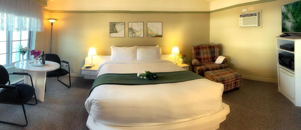 Postel nebo postele na pokoji v ubytování Motel La Cheminée