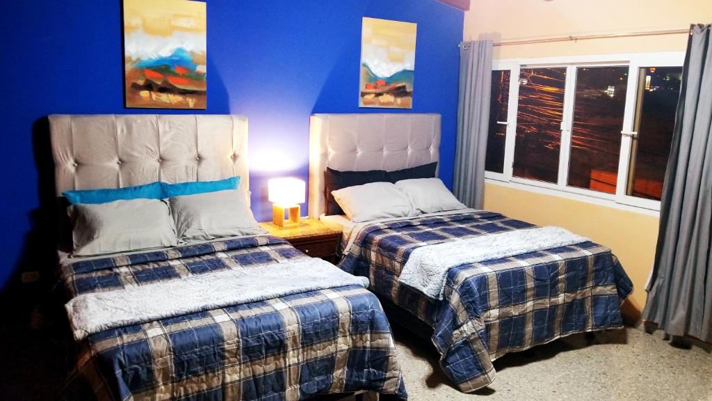 Postel nebo postele na pokoji v ubytování Portal los Castaños
