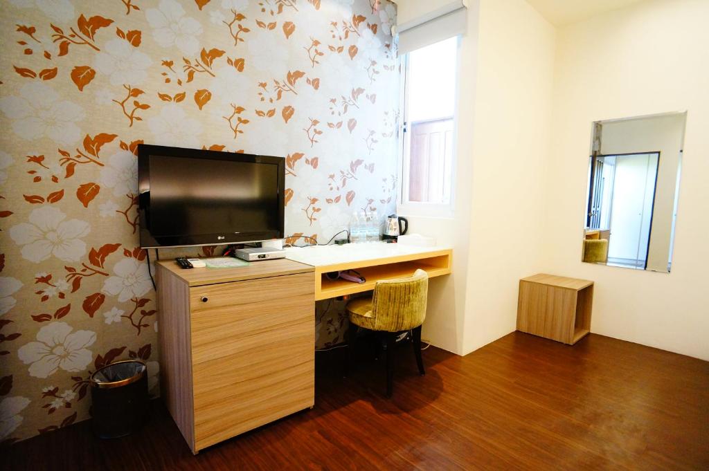 TV a/nebo společenská místnost v ubytování Green Yard B&B