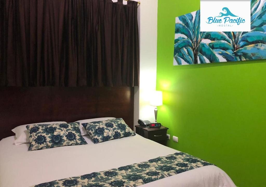 Postel nebo postele na pokoji v ubytování Hostal Blue Pacific