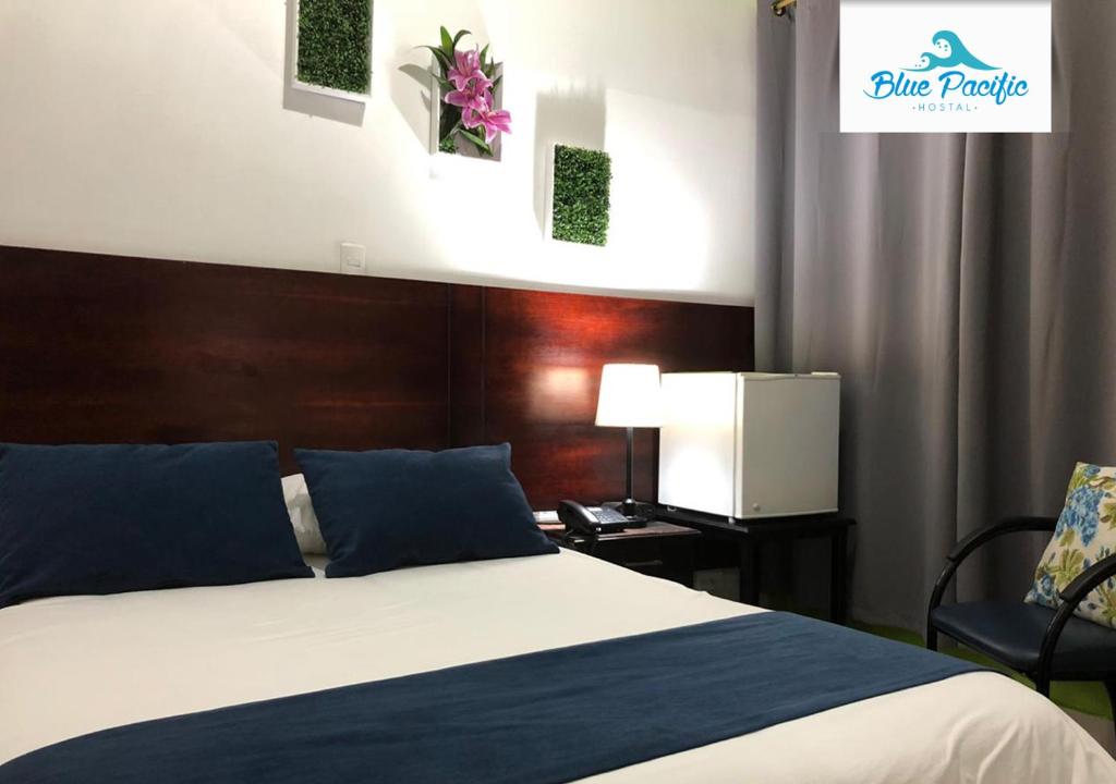 Postel nebo postele na pokoji v ubytování Hostal Blue Pacific