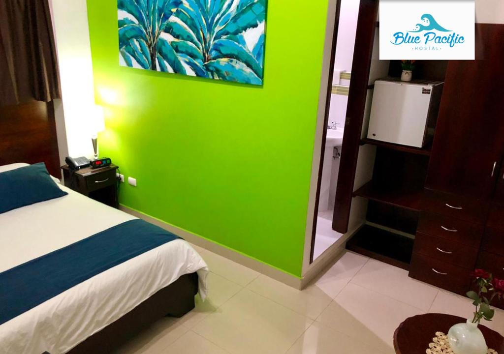 Postel nebo postele na pokoji v ubytování Hostal Blue Pacific