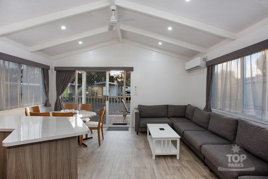 a living room with a couch and a table at Horsham Riverside Caravan Park in Horsham