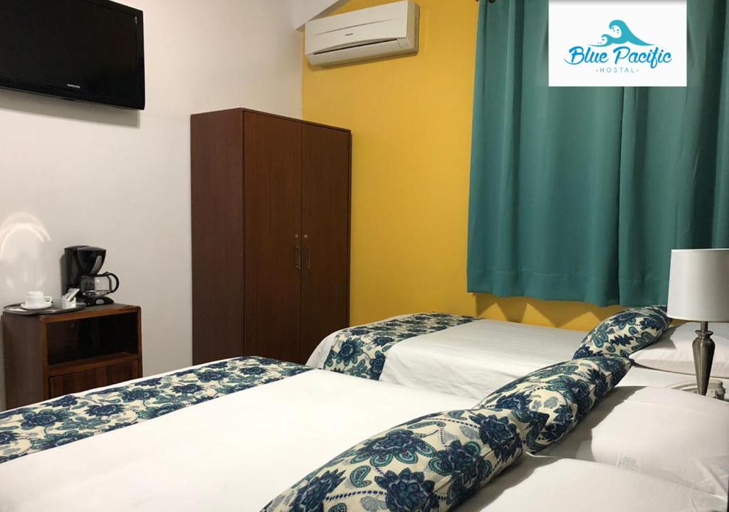 Postel nebo postele na pokoji v ubytování Hostal Blue Pacific