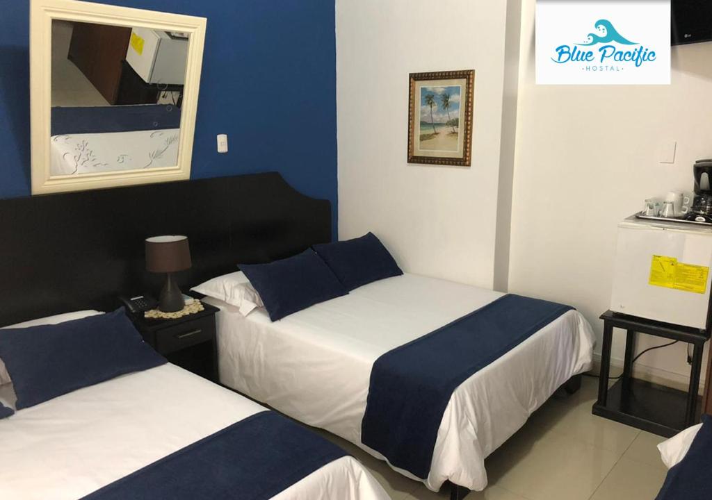 Postel nebo postele na pokoji v ubytování Hostal Blue Pacific