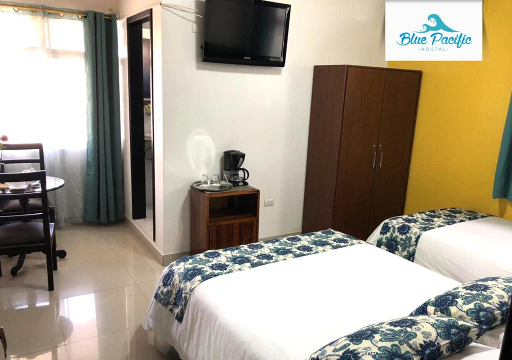 Postel nebo postele na pokoji v ubytování Hostal Blue Pacific