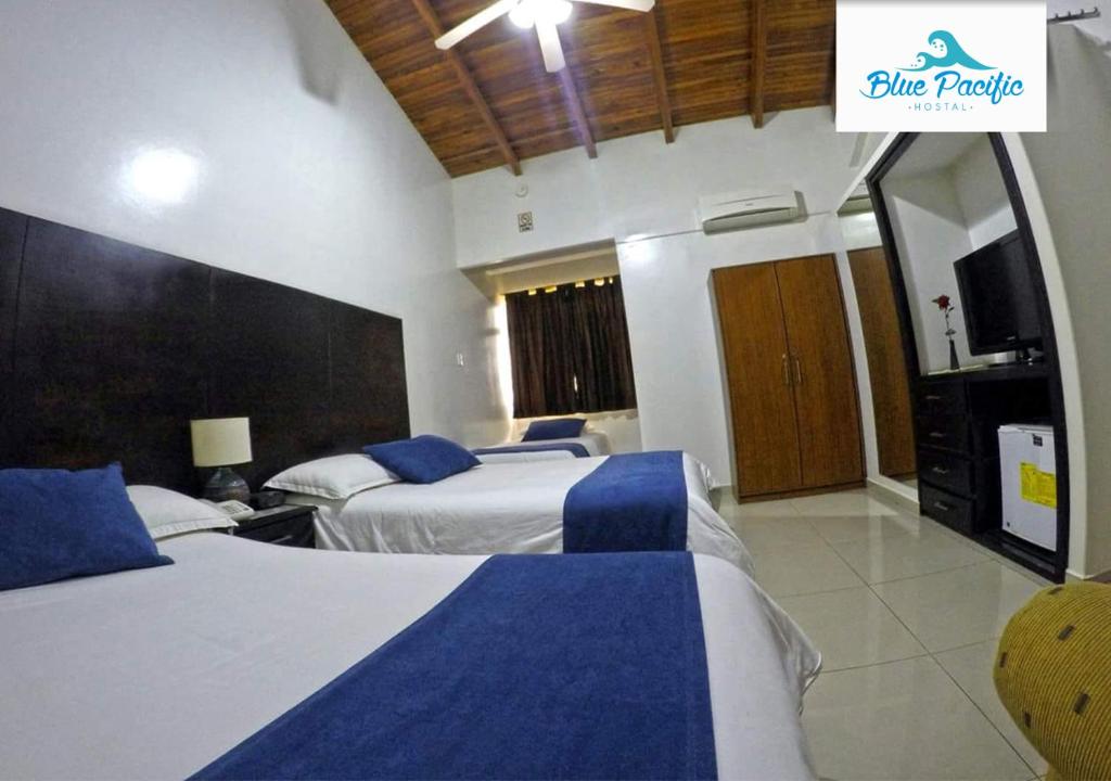 Postel nebo postele na pokoji v ubytování Hostal Blue Pacific