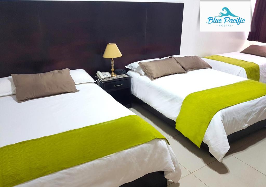 Postel nebo postele na pokoji v ubytování Hostal Blue Pacific