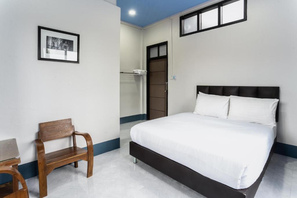 Postel nebo postele na pokoji v ubytování Udomsuk Hotel