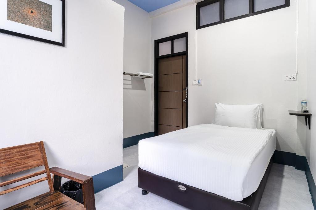 Postel nebo postele na pokoji v ubytování Udomsuk Hotel