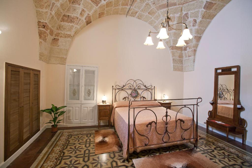 Postel nebo postele na pokoji v ubytování Residencefusaro appartamenti Specchia