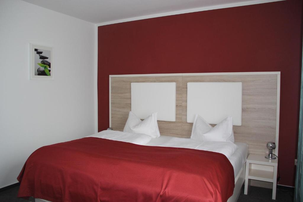 Postel nebo postele na pokoji v ubytování Stadthotel Alsfeld